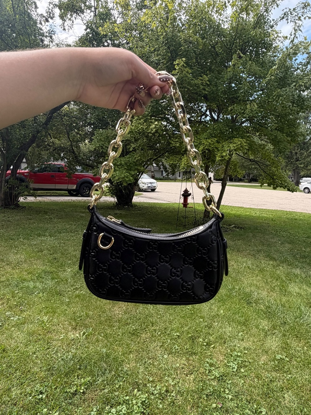 Black Embossed Leather Shoulder Bag with Gold Chain